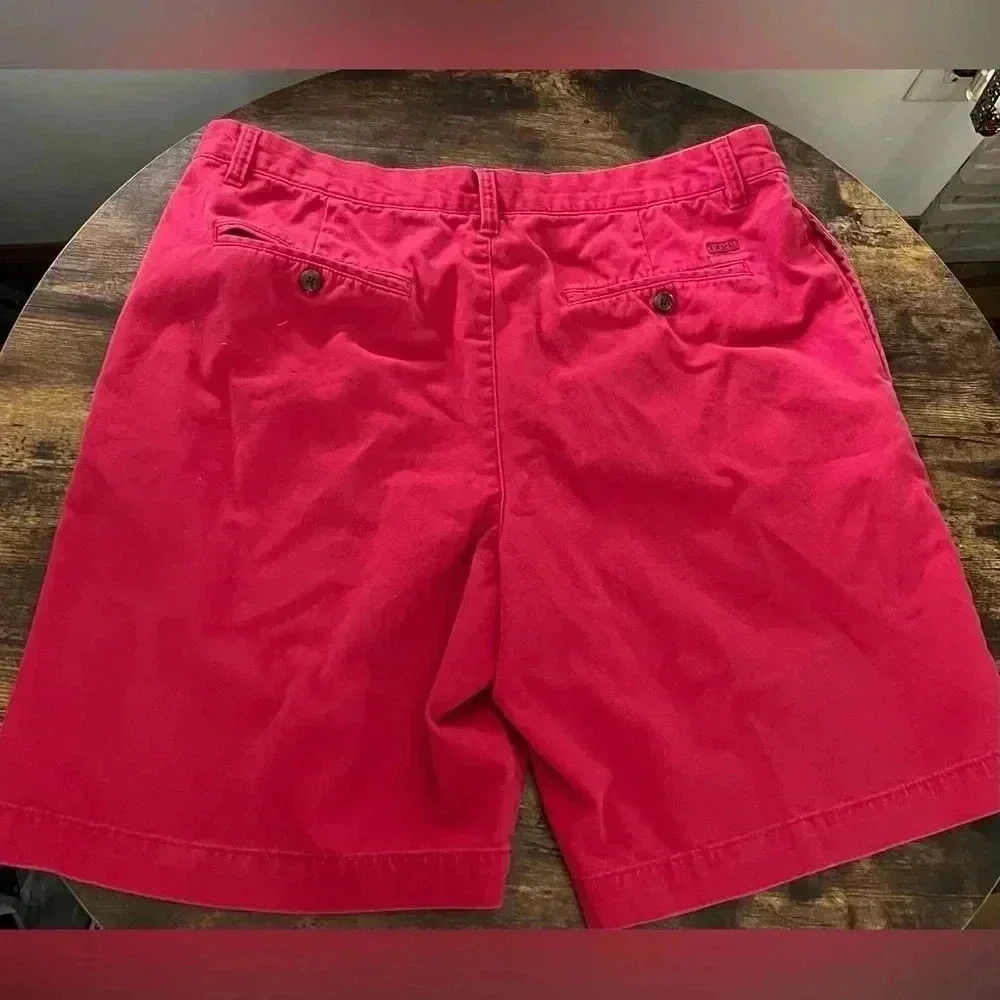 IZOD | men’s red flat front shorts. Size: 38​